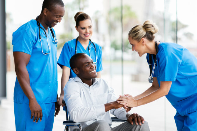 female-doctor-greeting-disabled-patient.jpg